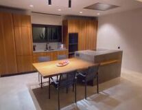 a kitchen with an island in the middle of a room